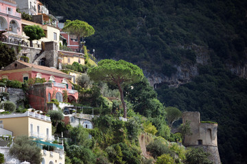 Fototapeta na wymiar Positano houses on steep hill with tower