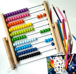Children's multicolored abacus, pencils, markers