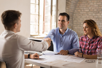 Young couple meeting with their financial advisor.
