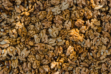 some walnut seeds forming a background pattern