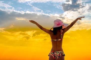 Silhouette freedom woman rise hands up to welcome a good day , open arms motivate enjoy and success about love