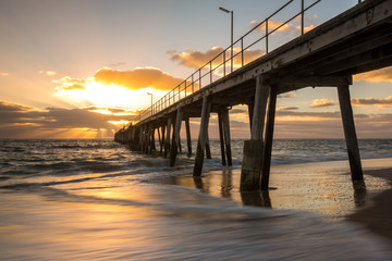 Fototapeta na wymiar Sunset over the Jetty at Port Noarlunga South Australia Australia on the 25th February 2018