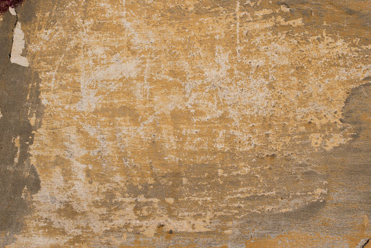 Texture of an old yellow wall.