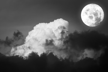 Naklejka na ściany i meble Dramatic atmosphere panorama view of Full moon with beautiful summer exotic night sky and clouds background in Black and White.Element of Full moon image furnished by NASA.