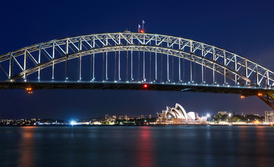 Fototapeta na wymiar Long exposure of Sydney Harbour Bridge at night against a deep blue sky