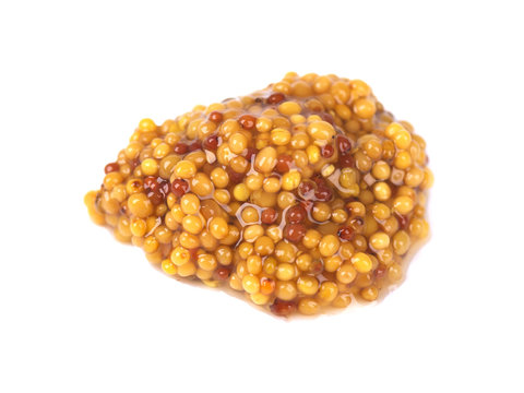 Typical french dijon rough mustard isolated on white background. Whole grain Dijon mustard with brown seeds.