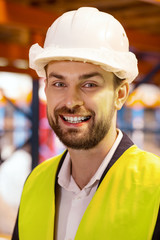 Stable job. Portrait of a happy storehouse worker while looking at you