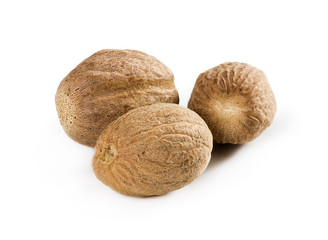 Three nutmeg isolated on white background