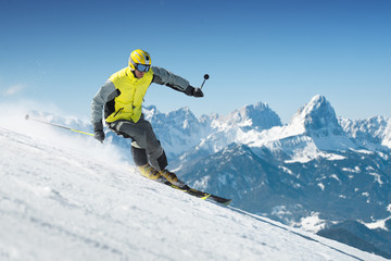 Naklejka na ściany i meble Skier in high mountains