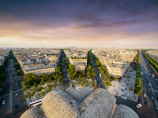 Paris Cityscape taken from Arc de Triomphe with streets, cars and buildings in the front.
