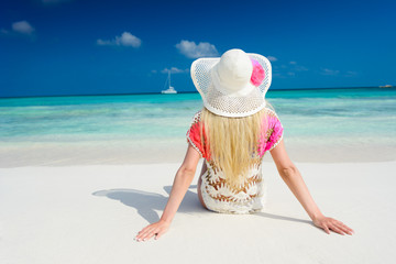 Girl on the beach at sunny day