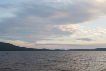 coast of the mountain lake Zyuratkul in the evening