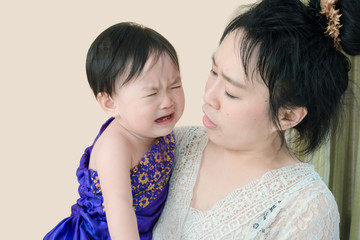 mother appeases her baby when crying with love