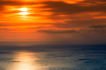 Naklejka na ściany i meble Sunset or sunrise over sea surface