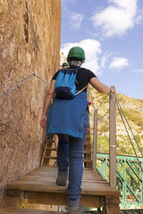 Hiker woman walking in mountains , King Little Pathway in Malaga city  , Spain