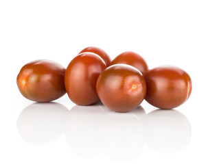 Six black red grape cherry tomatoes isolated on white background.