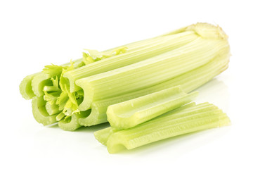 Fresh green celery with three sliced sticks isolated on white background.