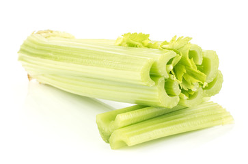 Fresh green celery and two sliced sticks isolated on white background.