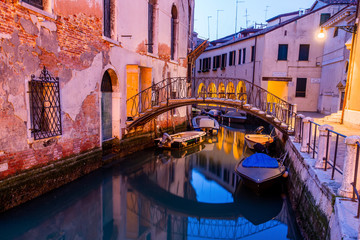 Fototapeta na wymiar Canal view in Venice, Italy at blue hour before sunrise