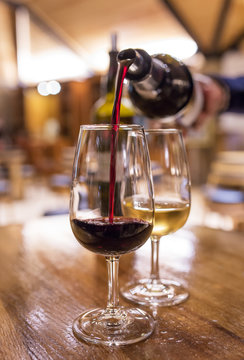 Fototapeta Degustation of white and red port wine in tasting room in Porto, Portugal