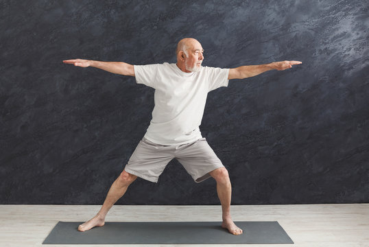 Senior Man Practicing Yoga Indoors