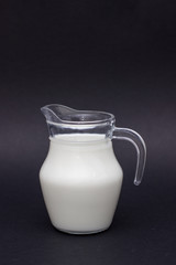 Glass jug with milk