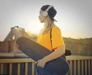 Urban girl with skateboard © olly
