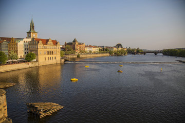 Vltava river in spring Prague, with many of turistic boats, view from Charles bridge
