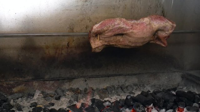 cooking pork ribs and chicken on a charcoal bbq 