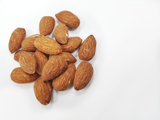 Group of almonds on white background