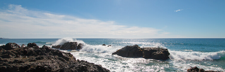 Fototapeta na wymiar Waves breaking on rocky coast at Cerritos Beach between Todos Santos and Cabo San Lucas in Baja California Mexico BCS