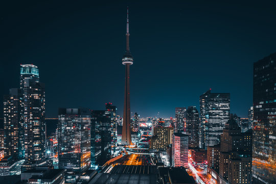 Entire futuristic city skyline view of downtown Toronto Canada. Modern buildings, urban architecture, cars travelling. construction and development in a busy city © Tyler