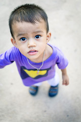Asian Little cute child boy looking up