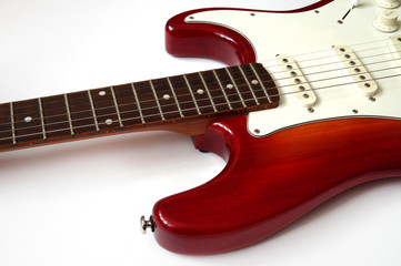 Fototapeta na wymiar red electric guitar with a white deco