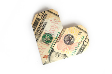 a ten-dollar bill folded in the shape of a heart