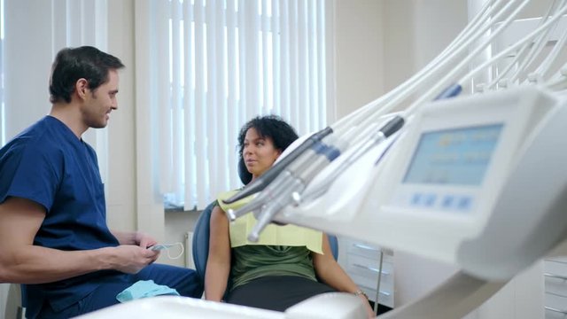 Man dentist and his pacient in private practice.