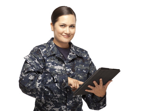Female navy officer with digital tablet