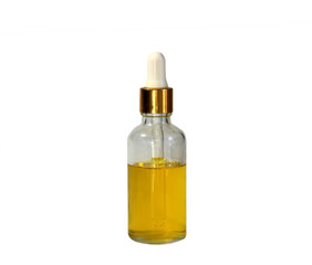 bright Golden cosmetic oil stands in clear vial with dropper on white isolated background