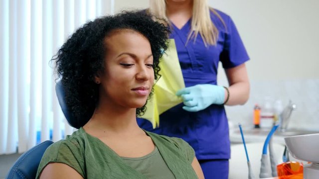 Dentist and his assitant working in private practice.