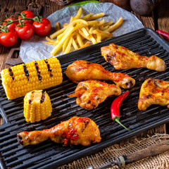 Rustic Grilled chicken wings,legs,and spicy corn