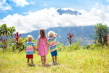  Children hiking in mountains and jungle.