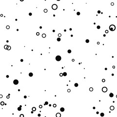 Abstract seamless pattern with black chaotic small circles, rings on white. Infinity messy geometric pattern. Vector illustration. 