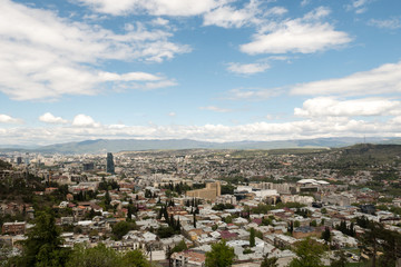 Fototapeta na wymiar Picturesque sky above the capital of Georgia, Tbilisi. Top view.