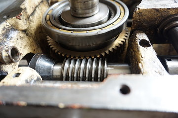 Obraz na płótnie Canvas Disassembled machine with reducer, screws, bearings, worm shaft.