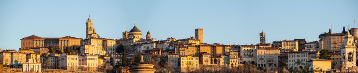 Fototapeta na wymiar Bergamo, Italy. Landscape on the old town located on the top of the hill from the new city (downtown) at the sunrise