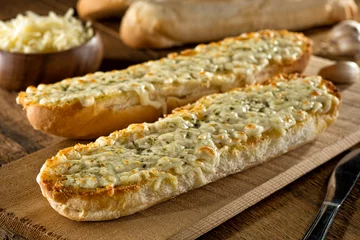 Gordijnen Garlic Bread with Melted Mozzarella Cheese and Herbs © fudio