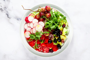 summer fresh healthy vegan lunch bowl. shot from above on a white marble table. copy space, healthy eating