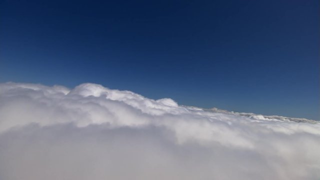 Level flight above fluffy cloud layer
