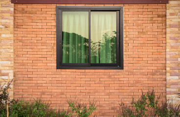 front view of window exterior on brick wall