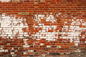 Spotted by white paint old red brick wall texture background